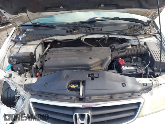 2004 Honda Odyssey EX-L with VIN 5FNRL18924B064040, listed as a IAAI auction lot 41350306 with 130,803 mi miles and . Bid and sale history available at DreamBid. Image 10.