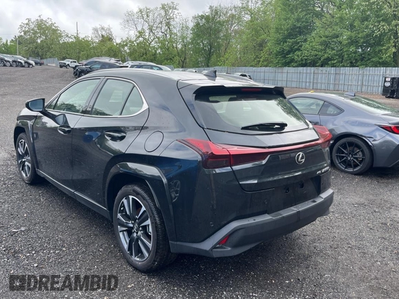 2025 Lexus UX 300h with VIN JTHUCJDH8S2003698, listed as a Copart auction lot 56182345 with 1,111 mi miles and Salvage title. Bid and sale history available at DreamBid. Image 3.