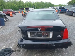 2002 Cadillac DeVille DTS z VIN 1G6KF579320288667, wystawiony jako IAAI lot #42331236 z przebiegiem 71 189 mil mil oraz . Historia ofert i sprzedaży dostępna na DreamBid. Obrazek 16.