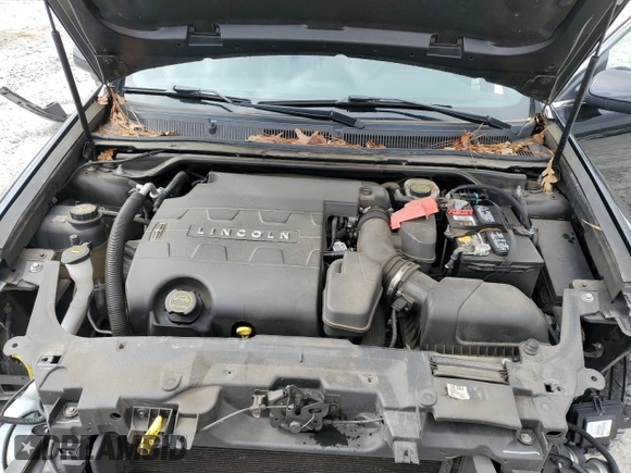 2015 Lincoln MKS z VIN 1LNHL9DK4FG603765, wystawiony jako Copart lot #47533935 z przebiegiem 75 284 mil mil oraz Szkoda całkowita • Salvage title. Historia ofert i sprzedaży dostępna na DreamBid. Obrazek 11.