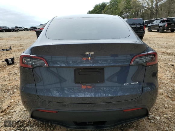 2023 Tesla Model Y Long Range z VIN 7SAYGDEE5PA164270, wystawiony jako Copart lot #50260835 z przebiegiem 17 340 mil mil oraz Szkoda całkowita • Salvage title. Historia ofert i sprzedaży dostępna na DreamBid. Obrazek 6.
