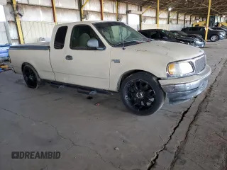 1999 Ford F-150 with VIN 1FTZX172XXKA26359, listed as a Copart auction lot 52215805 with 268,403 mi miles and Salvage title. Bid and sale history available at DreamBid. Image 4.