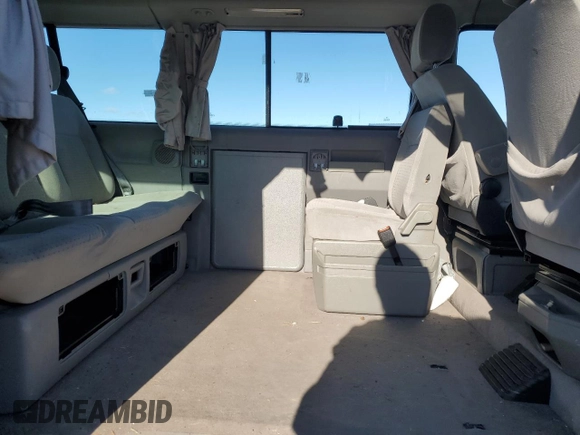 2003 Volkswagen EuroVan MV с VIN WV2NB47033H029173, выставлен на аукционе Copart как лот 82377584 с пробегом 231 083 миль миль и Чистый • Clean title. История ставок и продаж доступна на DreamBid. Изображение 11.
