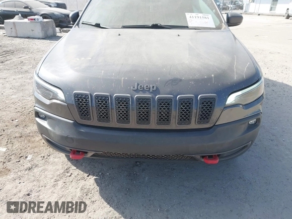 2019 Jeep Cherokee Trailhawk with VIN 1C4PJMBX3KD246100, listed as a IAAI auction lot 41191581 with 98,124 mi miles and . Bid and sale history available at DreamBid. Image 6.