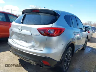2016 Mazda CX-5 Grand Touring with VIN JM3KE4DY9G0795360, listed as a IAAI auction lot 41933991 with 176,373 mi miles. Bid and sale history available at carsss.com. Image 4.