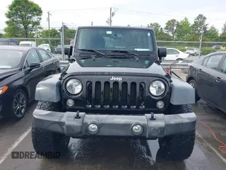 2015 Jeep Wrangler Unlimited Willys Wheeler with VIN 1C4BJWDG4FL687829, listed as a IAAI auction lot 42099147 with 98,969 mi miles and . Bid and sale history available at DreamBid. Image 13.