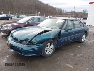 1996 Pontiac Bonneville z VIN 1G2HZ5210TH210829, wystawiony jako IAAI lot #41203888 z przebiegiem 154 990 mil mil oraz . Historia ofert i sprzedaży dostępna na DreamBid. Obrazek 17.