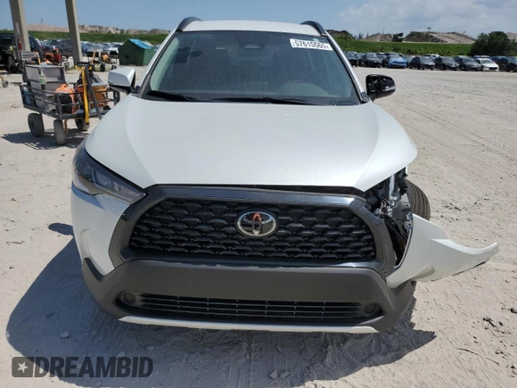 2024 Toyota Corolla Cross LE with VIN 7MUCAAAG7RV090677, listed as a Copart auction lot 57615565 with 6,910 mi miles and Salvage title. Bid and sale history available at DreamBid. Image 5.