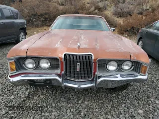 1973 Mercury Cougar z VIN 2F91H514784, wystawiony jako Copart lot #86101104 z przebiegiem 74 018 mil mil oraz Szkody całkowita. Historia ofert i sprzedaży dostępna na DreamBid. Obrazek 5.