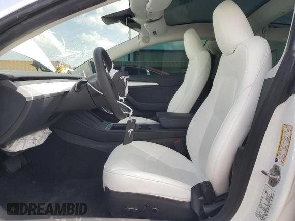 2023 Tesla Model 3 with VIN 5YJ3E1EA8PF499535, listed as a Copart auction lot 59974115 with 18,365 mi miles and Salvage title. Bid and sale history available at DreamBid. Image 7.