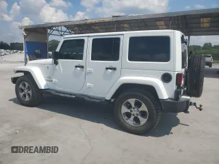 2016 Jeep Wrangler Unlimited Sahara with VIN 1C4BJWEG6GL182794, listed as a Copart auction lot 57880725 with 127,752 mi miles and Salvage title. Bid and sale history available at DreamBid. Image 2.