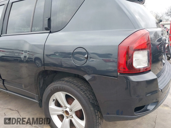 2014 Jeep Compass Sport with VIN 1C4NJCBB0ED647937, listed as a IAAI auction lot 41444062 with 135,679 mi miles and . Bid and sale history available at DreamBid. Image 18.