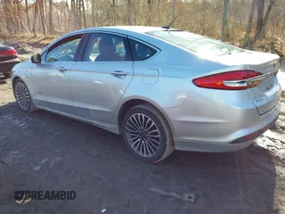 2018 Ford Fusion Energi SE with VIN 3FA6P0PU0JR164192, listed as a IAAI auction lot 41821301 with 114,141 mi miles. Bid and sale history available at carsss.com. Image 3.