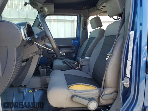 2010 Jeep Wrangler Unlimited Sahara with VIN 1J4HA5H11AL143608, listed as a Copart auction lot 46091715 with 480,747 mi miles and Salvage Title. Bid and sale history available at carsss.com. Image 7.