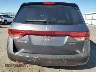 2014 Honda Odyssey Touring with VIN 5FNRL5H96EB061876, listed as a Copart auction lot 49759935 with 132,591 mi miles and Salvage Title. Bid and sale history available at DreamBid. Image 6.
