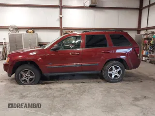 2007 Jeep Grand Cherokee Laredo with VIN 1J8GR48K97C631672, listed as a IAAI auction lot 41520054 with 231,576 mi miles. Bid and sale history available at carsss.com. Image 14.