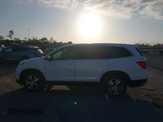 2017 Honda Pilot EX-L with VIN 5FNYF6H51HB037690, listed as a IAAI auction lot 41976359 with 126,055 mi miles and . Bid and sale history available at DreamBid. Image 14.