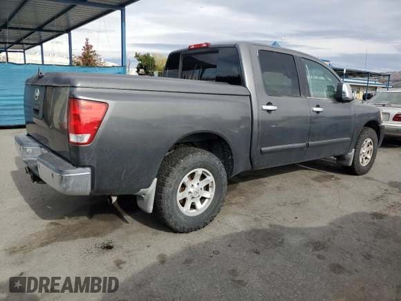 2005 Nissan Titan SE with VIN 1N6AA07B65N566082, listed as a Copart auction lot 80879174 with 215,297 mi miles and Clean Title. Bid and sale history available at carsss.com. Image 3.