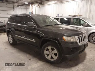 2012 Jeep Grand Cherokee Laredo with VIN 1C4RJFAG6CC266144, listed as a IAAI auction lot 41497163 with 233,755 mi miles. Bid and sale history available at carsss.com. Image 1.
