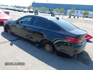 2018 Acura TLX w/A-SPEC Pkg with VIN 19UUB2F69JA007609, listed as a IAAI auction lot 41754437 with 195,047 mi miles. Bid and sale history available at carsss.com. Image 3.