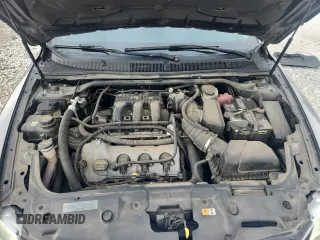 2011 Ford Taurus Limited z VIN 1FAHP2JW1BG156691, wystawiony jako Copart lot #59811755 z przebiegiem 162 828 mil mil oraz Szkoda całkowita • Salvage title. Historia ofert i sprzedaży dostępna na DreamBid. Obrazek 11.