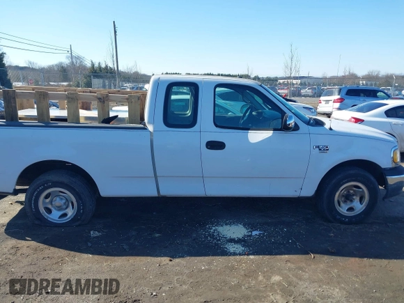 2000 Ford F-150 z VIN 2FTPX17L7YCA51774, wystawiony jako IAAI lot #41426958 z przebiegiem 421 412 mil mil oraz . Historia ofert i sprzedaży dostępna na DreamBid. Obrazek 13.