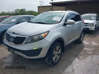 2011 Kia Sportage LX with VIN KNDPB3A23B7053943, listed as a IAAI auction lot 42063941 with 234,364 mi miles and . Bid and sale history available at carsss.com. Image 2.