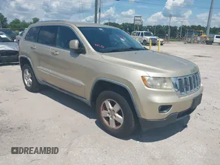 2011 Jeep Grand Cherokee Laredo with VIN 1J4RR4GG9BC734574, listed as a IAAI auction lot 42603119 with 111,894 mi miles and . Bid and sale history available at DreamBid. Image 1.
