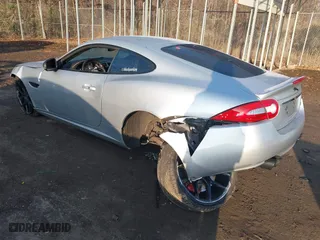 2014 Jaguar XK with VIN SAJWA4DC7EMB52199, listed as a IAAI auction lot 41191119 with 90,585 mi miles. Bid and sale history available at carsss.com. Image 3.