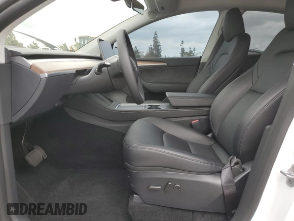2024 Tesla Model Y Long Range with VIN 7SAYGDEE8RF088808, listed as a Copart auction lot 50406865 with 8,150 mi miles and Salvage title. Bid and sale history available at DreamBid. Image 7.