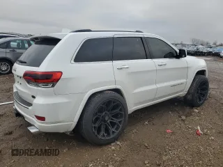 2014 Jeep Grand Cherokee Overland with VIN 1C4RJFCG7EC572298, listed as a Copart auction lot 83970004 with 104,861 mi miles and Salvage Title. Bid and sale history available at DreamBid. Image 3.