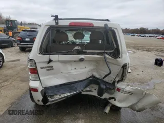 2009 Mercury Mariner Premier with VIN 4M2CU87G79KJ03236, listed as a Copart auction lot 84059324 with 130,335 mi miles and Salvage title. Bid and sale history available at DreamBid. Image 6.