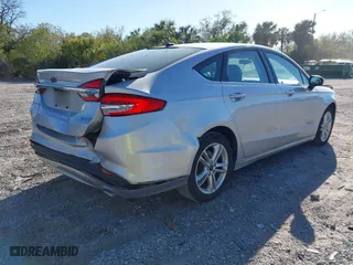 2018 Ford Fusion Hybrid S with VIN 3FA6P0UU8JR244912, listed as a IAAI auction lot 41742940 with 65,885 mi miles. Bid and sale history available at carsss.com. Image 4.