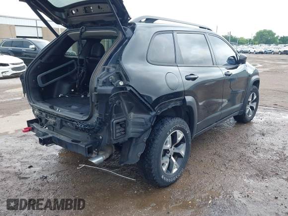 2015 Jeep Cherokee Trailhawk with VIN 1C4PJMBS5FW647601, listed as a IAAI auction lot 42437734 with 170,640 mi miles and . Bid and sale history available at DreamBid. Image 4.