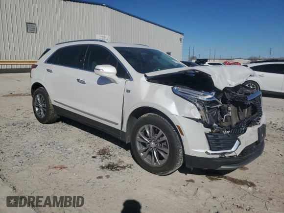 2021 Cadillac XT5 FWD Premium Luxury with VIN 1GYKNCRSXMZ135949, listed as a Copart auction lot 47752805 with 99,838 mi miles and Salvage Title. Bid and sale history available at carsss.com. Image 4.