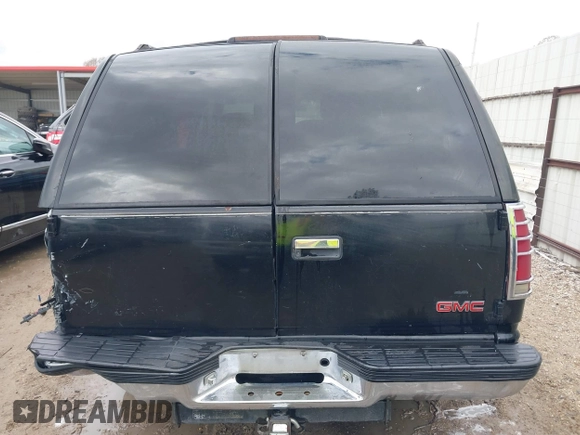 1998 GMC Yukon with VIN 1GKEC13R8WJ711255, listed as a IAAI auction lot 41457304 with 291,211 mi miles. Bid and sale history available at carsss.com. Image 16.