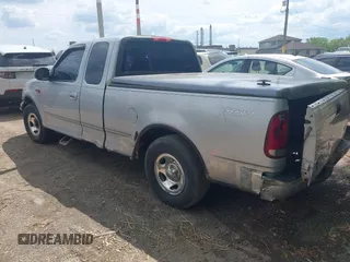 2001 Ford F-150 with VIN 2FTZX17221CB01390, listed as a IAAI auction lot 42194407 with 239,834 mi miles and . Bid and sale history available at DreamBid. Image 3.