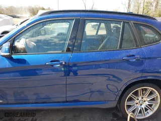 2015 BMW X1 sDrive28i with VIN WBAVM1C58FV314947, listed as a IAAI auction lot 41874472 with 128,271 mi miles. Bid and sale history available at carsss.com. Image 14.