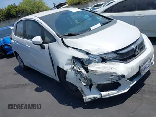 2019 Honda Fit LX z VIN 3HGGK5H40KM737343, wystawiony jako IAAI lot #42732609 z przebiegiem 71 343 mil mil oraz . Historia ofert i sprzedaży dostępna na DreamBid. Obrazek 1.