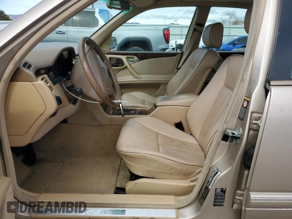 2000 Mercedes-Benz E-Class with VIN WDBJF82J0YX040071, listed as a Copart auction lot 50001165 with 145,638 mi miles and Salvage Title. Bid and sale history available at carsss.com. Image 7.