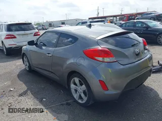 2013 Hyundai Veloster w/Black Int with VIN KMHTC6AD6DU169765, listed as a IAAI auction lot 41928516 with 130,708 mi miles and . Bid and sale history available at DreamBid. Image 3.