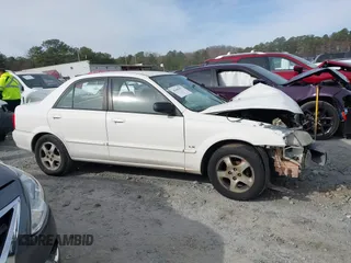 2000 Mazda Protege DX with VIN JM1BJ2221Y0208156, listed as a IAAI auction lot 41609657 with 435,304 mi miles and . Bid and sale history available at DreamBid. Image 12.