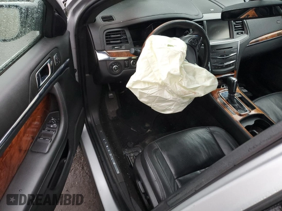 2015 Lincoln MKS with VIN 1LNHL9EK5FG607404, listed as a Copart auction lot 43246995 with Not provided miles and Salvage title. Bid and sale history available at DreamBid. Image 8.