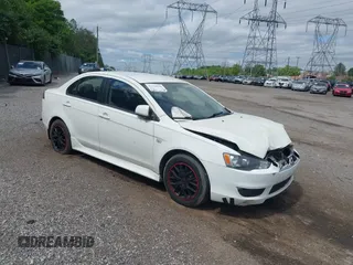 2014 Mitsubishi Lancer ES z VIN JA32U2FU5EU013005, wystawiony jako IAAI lot #42278946 z przebiegiem 154 899 mil mil oraz . Historia ofert i sprzedaży dostępna na DreamBid. Obrazek 1.