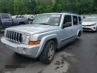 2009 Jeep Commander Sport z VIN 1J8HG48K29C531877, wystawiony jako Copart lot #58708825 z przebiegiem 198 585 mil mil oraz Szkoda całkowita • Salvage title. Historia ofert i sprzedaży dostępna na DreamBid. Obrazek 1.