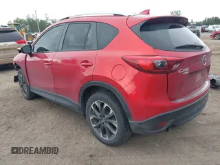 2016 Mazda CX-5 Grand Touring z VIN JM3KE4DY7G0687318, wystawiony jako IAAI lot #42228585 z przebiegiem 188 793 mil mil oraz . Historia ofert i sprzedaży dostępna na DreamBid. Obrazek 3.