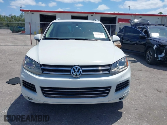 2012 Volkswagen Touareg Sport with VIN WVGEF9BP1CD008717, listed as a IAAI auction lot 42120641 with 211,580 mi miles and . Bid and sale history available at DreamBid. Image 6.