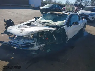 2015 BMW i8 with VIN WBY2Z2C51FV392854, listed as a IAAI auction lot 41282895 with 77,533 mi miles. Bid and sale history available at carsss.com. Image 2.