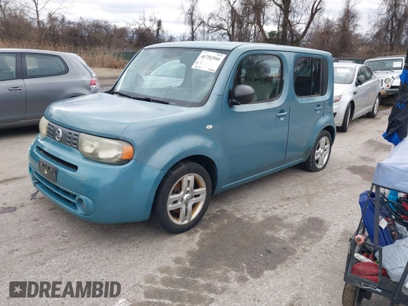 2010 Nissan Cube S z VIN JN8AZ2KRXAT170470, wystawiony jako IAAI lot #41751544 z przebiegiem 108 437 mil mil oraz . Historia ofert i sprzedaży dostępna na DreamBid. Obrazek 2.