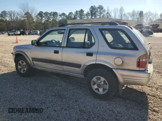 1999 Isuzu Rodeo S with VIN 4S2CK58W7X4357910, listed as a Copart auction lot 86955254 with 105,593 mi miles and Salvage Title. Bid and sale history available at DreamBid. Image 2.